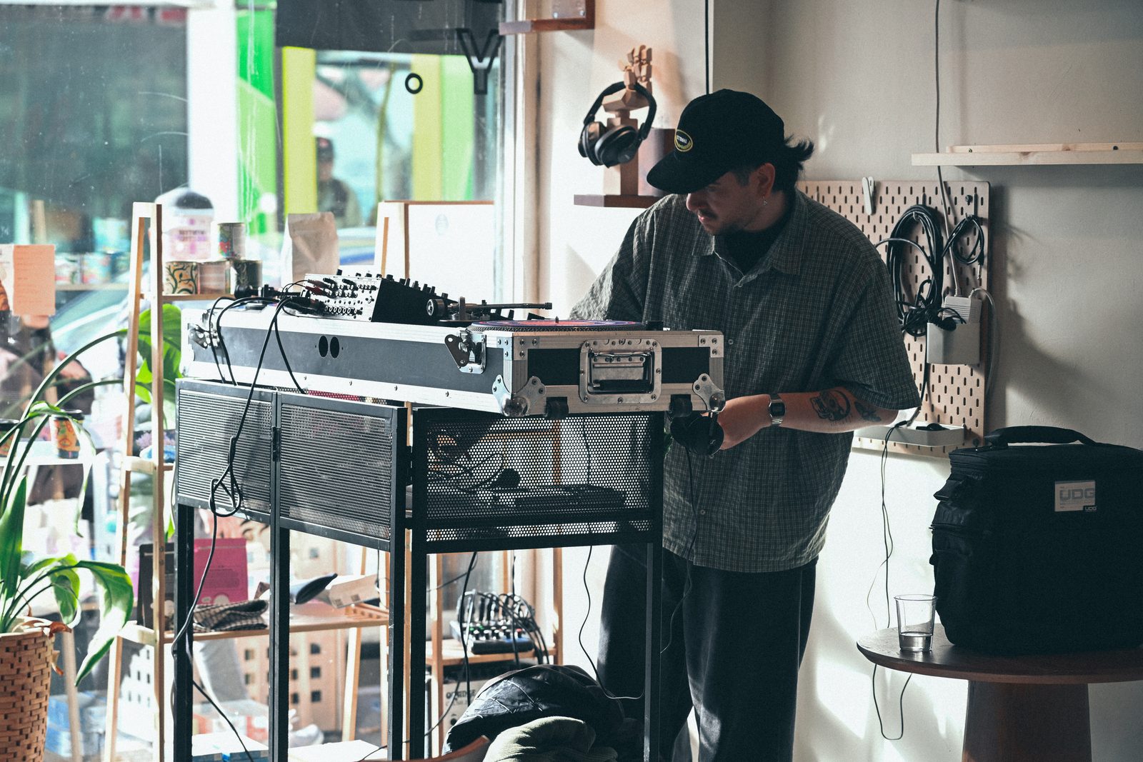 DJ setting up decks by the window at Acidity